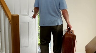 man-with-a-suitcase-leaving-the-home